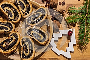 Sliced poppy seed roll and christmas ornaments