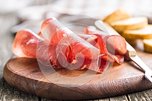 Sliced prosciutto crudo. photo