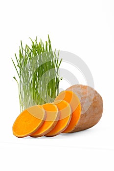 Sliced pumpkins and wheat seedlings