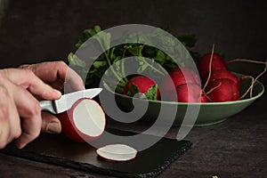 sliced radish on a dark background