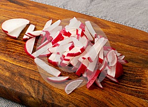 Sliced Radish Roots, Red Root Cuts, Red Radishes Slice Pile, Radis Pieces on Wood Background