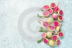 Sliced radish watermelon on the kitchen stone table, diet food.