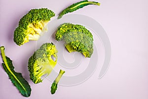 Sliced raw broccoli isolated on a pink background. Healthy vegan