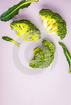 Sliced raw broccoli isolated on a pink background. Healthy vegan