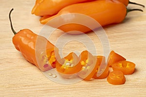 Sliced raw Peruvian Aji Amarillo pepper close up photo