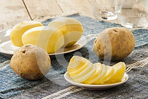 Sliced raw potato on kitchen table