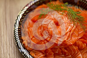 sliced raw salmon in dish