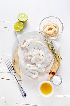 sliced raw squid rings with lime, olive oil, breadcrumbs. Preparation of Summer healthy snacks