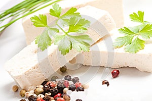 Sliced raw tofu with salt, pepper, parsley