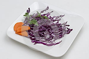 Sliced red cabbage in white plate