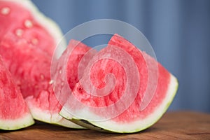 Sliced red-fleshed watermelon on table
