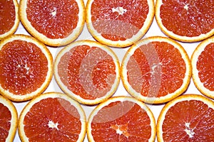 Sliced red grapefruit background texture