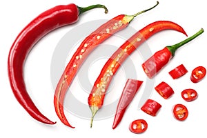 sliced red hot chili peppers isolated on white background top view