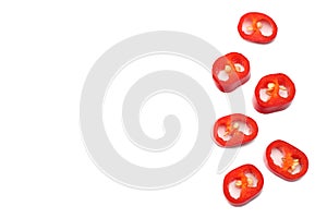 sliced red hot chili peppers isolated on white background top view