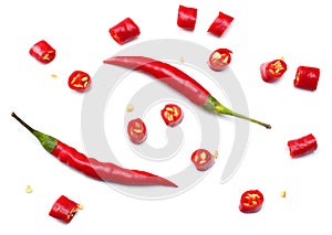 sliced red hot chili peppers isolated on white background top view