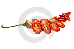 Sliced red hot chili peppers on a white background