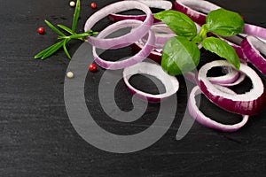 Sliced Red Onion or Purple Onion Rings on Black Background