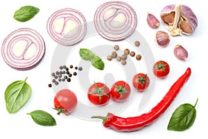Sliced red onion, red hot chili pepper, tomato, garlic and spices isolated on white background. top view