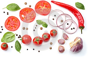 sliced red onion, red hot chili pepper, tomato, garlic and spices isolated on white background. top view
