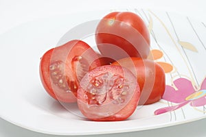 Sliced red tomatoes on a plate