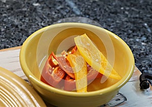 Sliced red and yellow sweet peppers.
