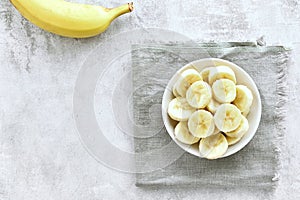 Sliced ripe banana in bowl