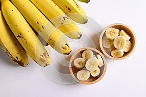 Sliced ripe banana fruit in a wooden bowl
