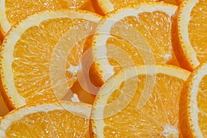 Sliced ripe oranges as a food background. Exotic fruits