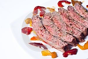 Sliced roast meat with pickled peppers