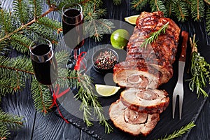 Sliced roast pork roulade with red wine