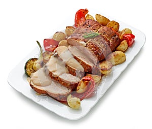 sliced roast pork with vegetables and sauce