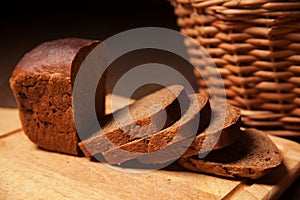 Sliced rye bread and basket closeup