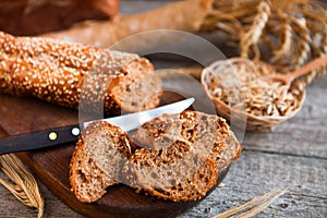 Sliced rye bread on a Board. On a wooden rustic table.