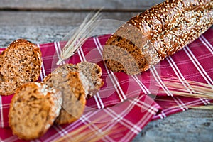 Sliced rye bread on a Board. On a wooden rustic table.