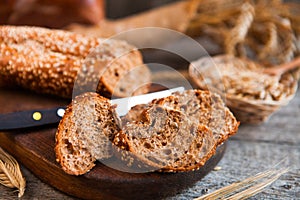 Sliced rye bread on a Board. On a wooden rustic table.