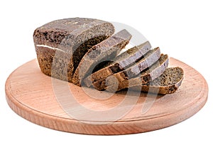 Sliced rye bread on a wooden board. Homebaked bread.