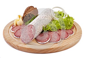 Sliced sausage with bread, butter and vegetables