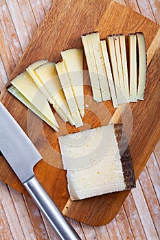 Sliced semi hard spanish sheep cheese Manchego, nobody