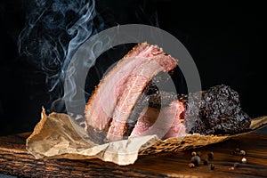 Sliced smoked beef brisket with dark crust from classic Texas BBQ photo