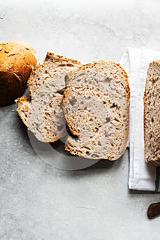 Sliced sourdough bread with nuts and nuts and oats. Top view