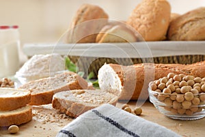 Sliced soy bread with beans flour and basket with bread