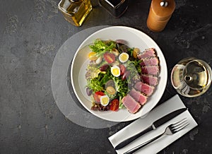 Sliced Steak of tuna in sesame and a salad