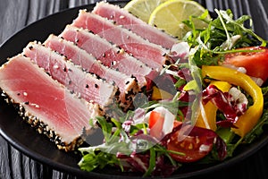 Sliced Steak of tuna in sesame and a salad of fresh vegetables c