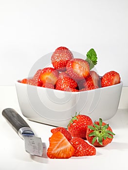 Sliced strawberry and fruit knife