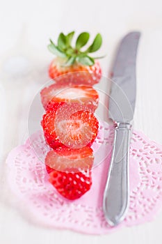 Sliced strawberry and knife