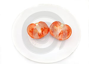 Sliced tomato on the plate.