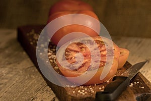 Sliced tomato on a wooden board