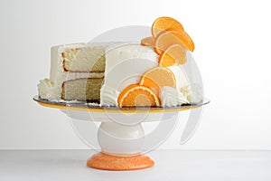 Sliced vanilla cake with orange slices