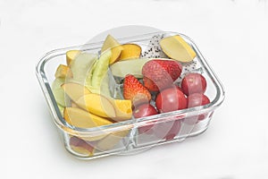 Sliced various fruit combinations are placed in glass containers and placed on a white background.