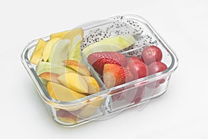 Sliced various fruit combinations are placed in glass containers and placed on a white background.